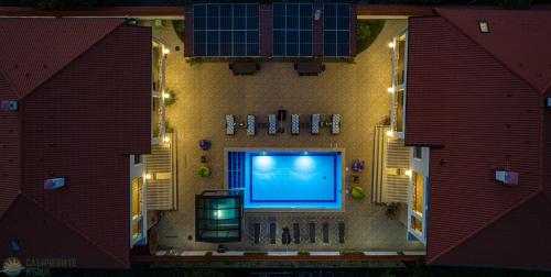 an overhead view of a swimming pool on a house with lights at Слънчевите Къщи in Banya