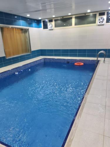 a swimming pool with a red frisbee in it at شاليهات دشيل لبيوت العطلات الاقتصادية in Taif