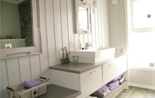 a bathroom with a sink and a mirror at Awesome Home In Stranda With Wifi in Stranda