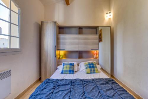 Ένα ή περισσότερα κρεβάτια σε δωμάτιο στο Madrague St Vincent Apt B