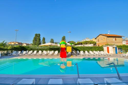 a swimming pool with a fire hydrant in a resort at Ciccio Hotel in Misano Adriatico
