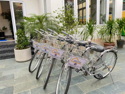 a row of bikes parked in front of a building at White House Central Villa in Hoi An