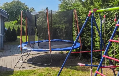 an empty trampoline in a yard at Pet Friendly Home In Ustronie Morskie With Kitchen in Ustronie Morskie