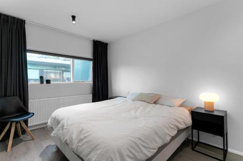 เตียงในห้องที่ Cozy 1BR Apt in Reykjavík