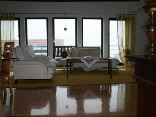 a living room with a couch and a coffee table at Ferienwohnung "Im Alten Gut" in Schaderode