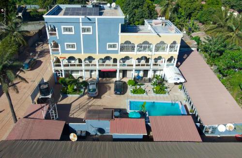 an aerial view of a house with a swimming pool at Sweet Mama in Bijilo