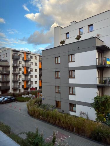 an apartment building in a city with a street at cybernetyki2 street INN near airport in Warsaw