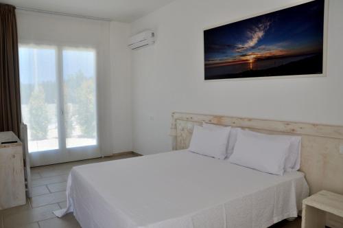 En eller flere senge i et værelse på Agriturismo La Turrita