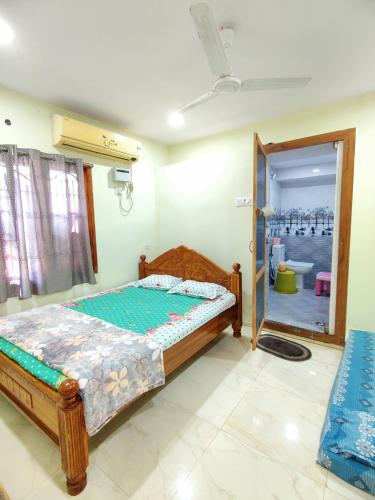 Postel nebo postele na pokoji v ubytování P V J RESIDENCY HOME Stay