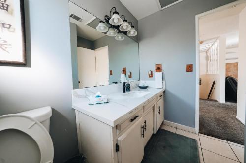 a bathroom with a sink and a toilet at Pebble Creek in Three Rivers