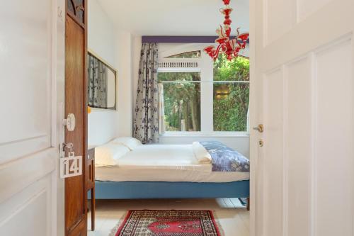 Ένα ή περισσότερα κρεβάτια σε δωμάτιο στο Villa Pambuffetti