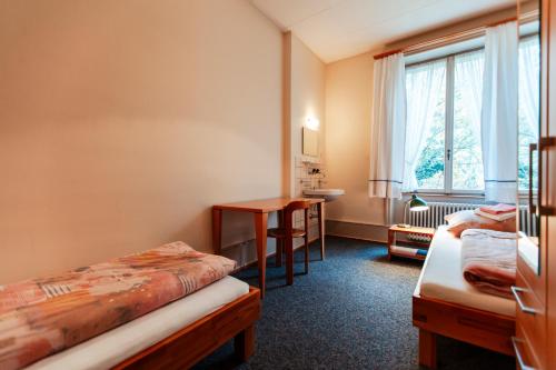 Postel nebo postele na pokoji v ubytování Chrischona Berg