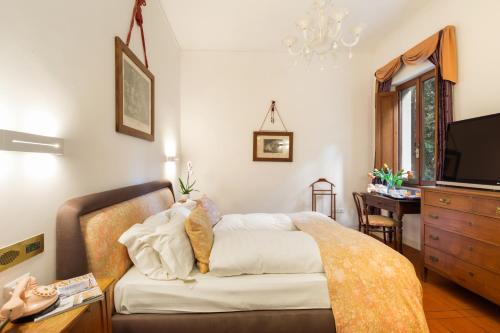 Ένα ή περισσότερα κρεβάτια σε δωμάτιο στο Villa Pambuffetti