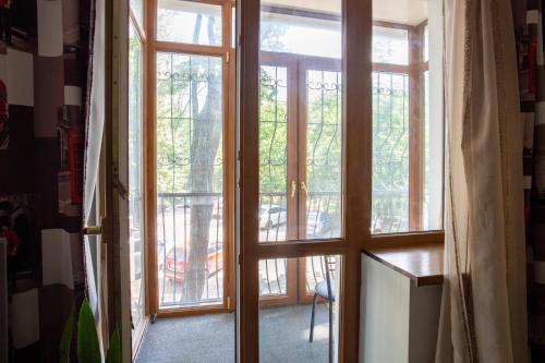 an open door with a view of a balcony at Naykova district Apartments in Kharkiv