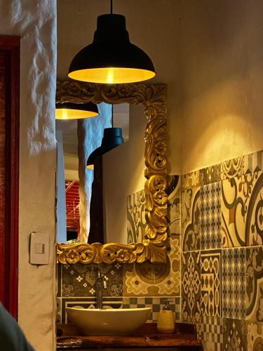 a bathroom with a sink and a mirror at BALCÓN DEL CIELO eco hotel glamping in Frailes