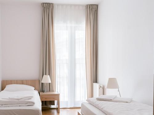 Säng eller sängar i ett rum på VacationClub – Górna Resorts Apartament 2.51