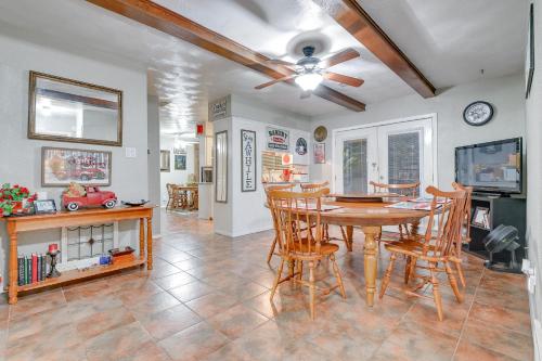 a dining room with a table and chairs at Walk to ATandT Stadium! Family Gem with Patio in Arlington