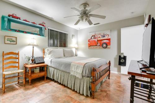 a bedroom with a bed and a ceiling fan at Arlington Vacation Rental, Walk to ATandT Stadium! in Arlington