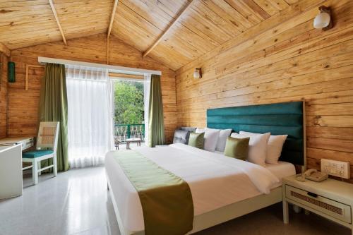 Voodi või voodid majutusasutuse Stone Wood Premier Dandeli toas