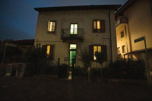 a building with its door lit up at night at Intero appartamento a Pero in Pero