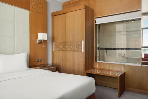 Ένα ή περισσότερα κρεβάτια σε δωμάτιο στο Vivid Jeddah Hotel, a member of Radisson Individuals