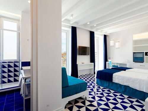 Postel nebo postele na pokoji v ubytování Maison Blu - Intimate GuestHouse