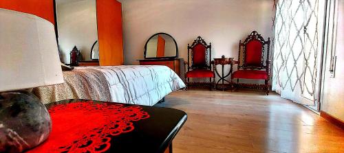 a bedroom with two beds and two mirrors at Comodo a tutti servizi in Abano Terme