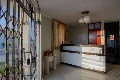 a room with a kitchen with a counter and a window at Raissa Hotel in Ilo