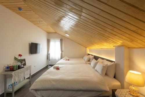 Ένα ή περισσότερα κρεβάτια σε δωμάτιο στο OLAGI HOTEL