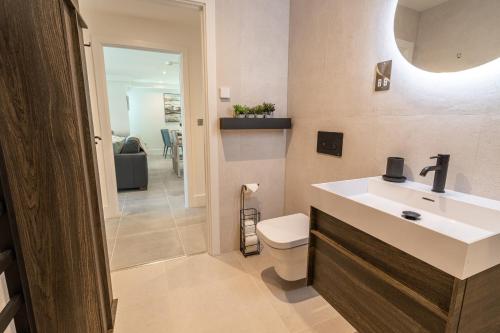a bathroom with a sink and a toilet at 31 Cliff Edge in Newquay