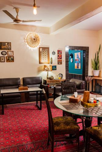 a living room with a couch and a table at Duroyo hotel in Gilgit