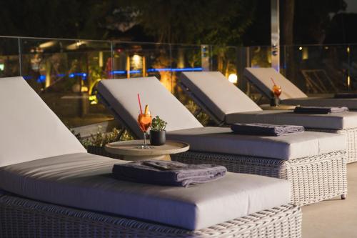 a row of beds sitting on top of a building at Elia Agia Marina Resort in Agia Marina Nea Kydonias