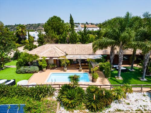 an aerial view of a house with a swimming pool at Casa Picota in Boliqueime