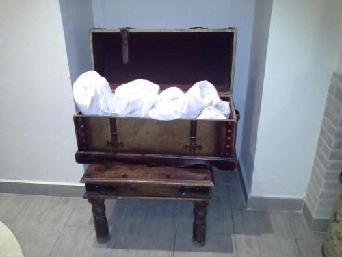 a chest full of toilet paper sitting on a table at Vogue Hotel Arezzo in Arezzo