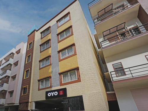 an apartment building with the oops sign on it at OYO 19749 New Shelton Suites in Yelahanka