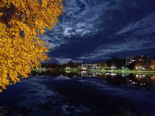 a view of a large lake at night at Scandinavian design apartment in the center in Rovaniemi