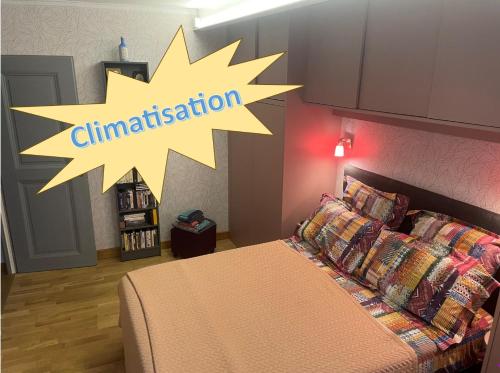 a bedroom with a bed with a sign that says stimulation at Chambre_privée_Collioure_centre in Collioure