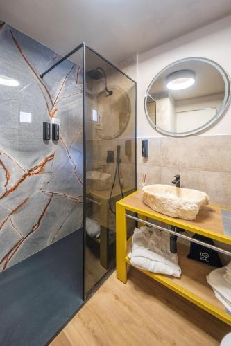 a bathroom with a sink and a mirror at Palazzo Licinio in Venafro