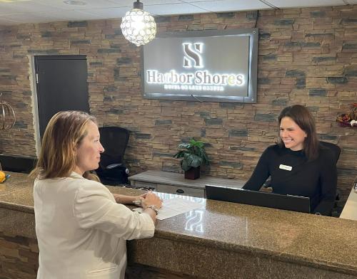 two women standing at a counter in a hair salon at Harbor Shores on Lake Geneva in Lake Geneva