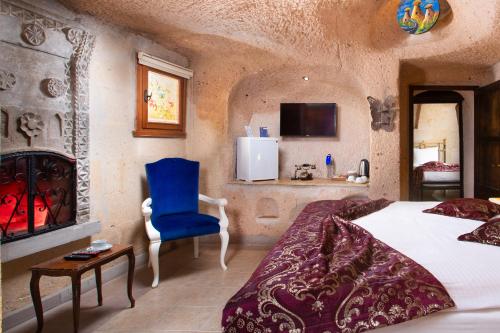 Кровать или кровати в номере Cappadocia Fairy Chimneys Selfie Cave Hotels - Special Class
