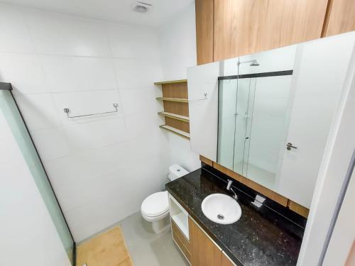 a bathroom with a sink and a mirror at APARTAMENTO FLAT STUDIO WEST FIT 711 a in Mossoró