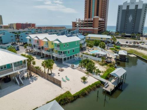 an aerial view of a city with buildings and a harbor at Green Family Bungalow! Beach Access, Pool, & Fishing Dock in Gulf Shores