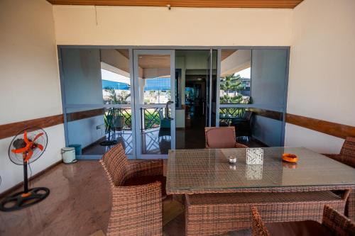 a dining room with a table and chairs at Beauty Hotel in Accra