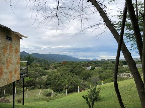 a view of a valley with mountains in the distance at Suite Pacandé , cerca al desierto de la tatacoa in Aipe