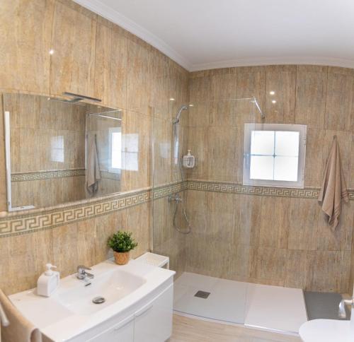 a bathroom with a tub and a sink and a shower at La Deseada in Murcia