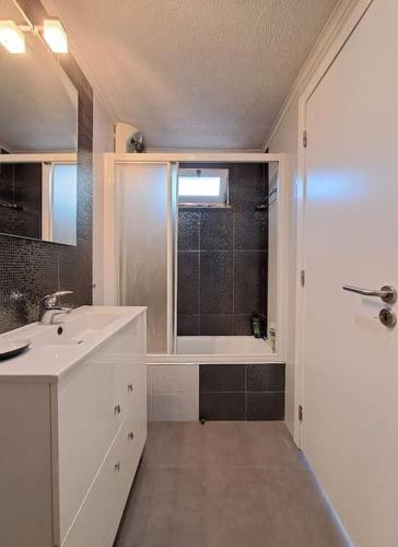 a bathroom with a sink and a shower with a window at BABhouse Lagar Antigo - Coração do Douro in Nagoselo do Douro