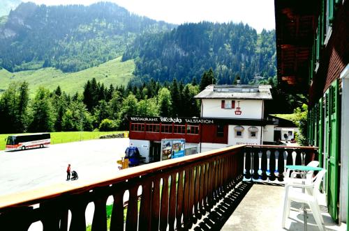 a balcony of a building with a view of a parking lot at Gasthaus Waldhaus in Melchtal