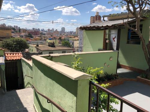 a view from the balcony of a green house at CASA DE FÉRIAS BH in Belo Horizonte