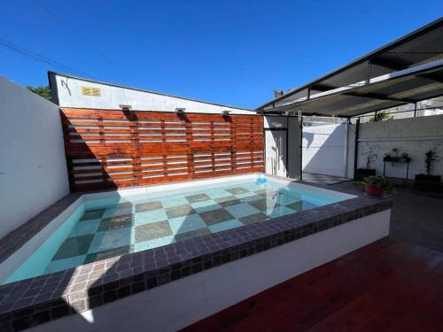 a swimming pool on the roof of a house at Babu Apart in Mar del Plata