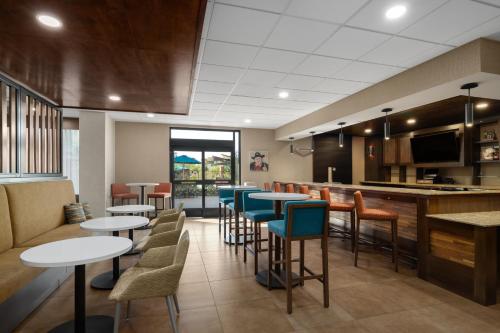a bar with tables and chairs in a restaurant at Hampton Inn Carefree, Az in Carefree
